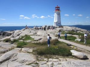 Peggys Cove lighthouse and piper