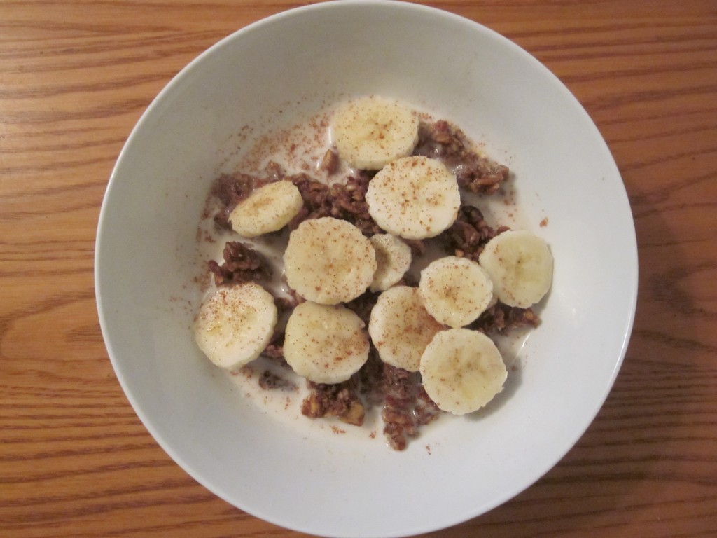 Granola with banana and almond milk in bowl