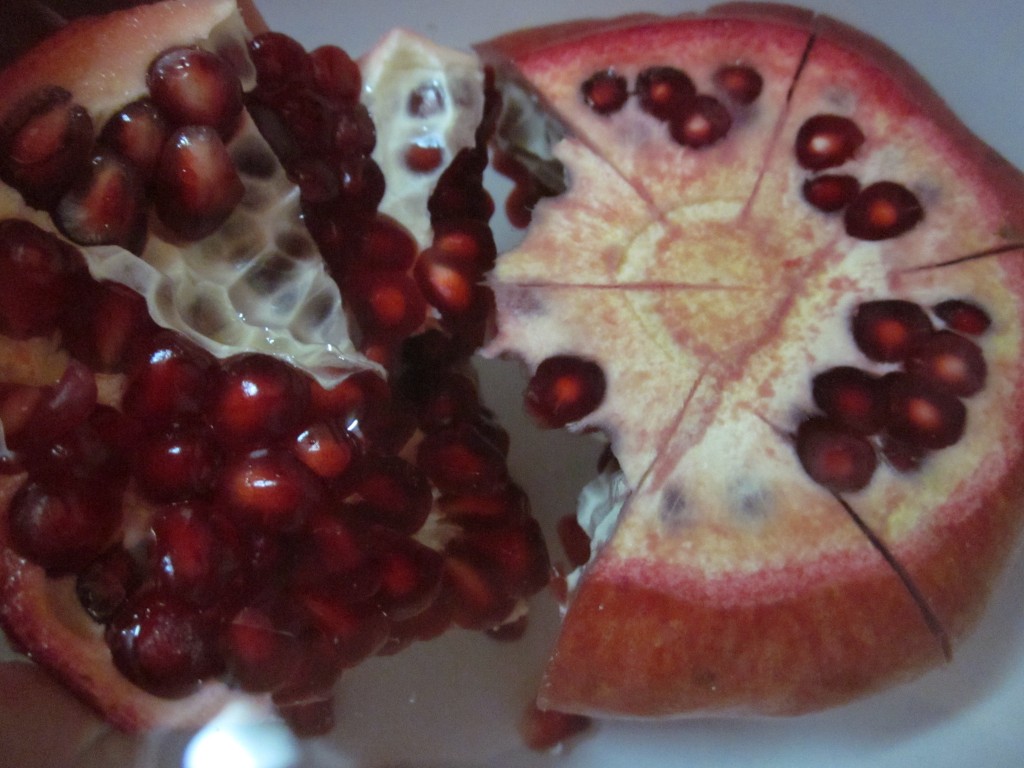 Pomegranate  pulling apart in water
