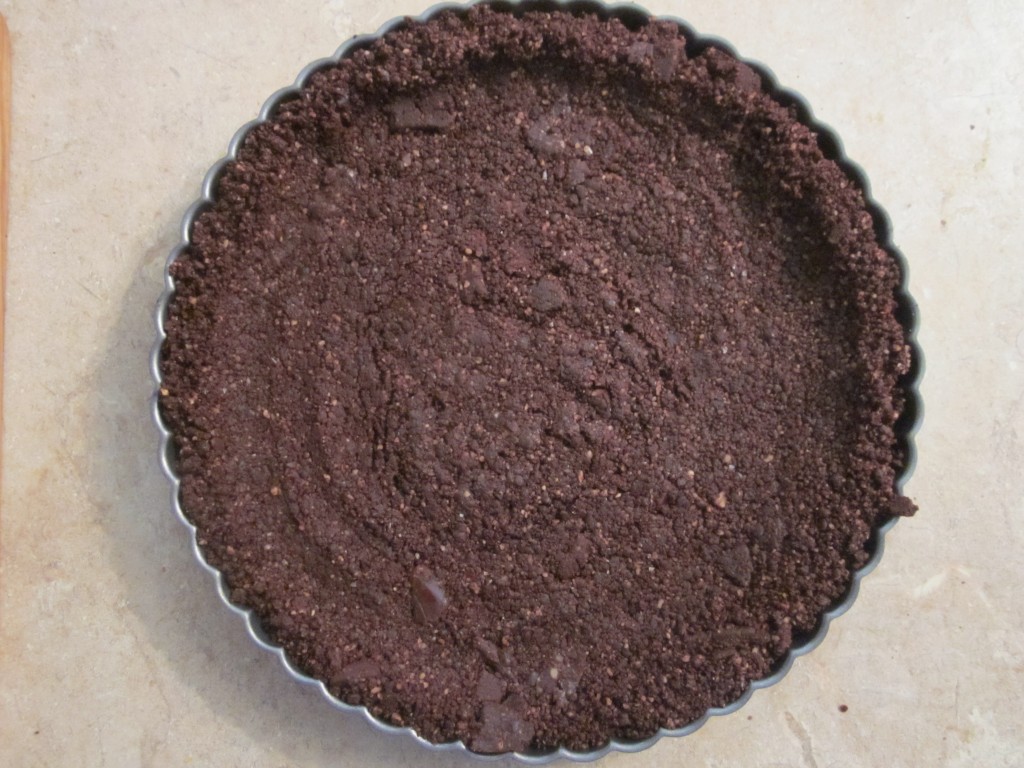 Black Forest Raw Chocolate Ganache Tart Recipe - brownie crust in pan