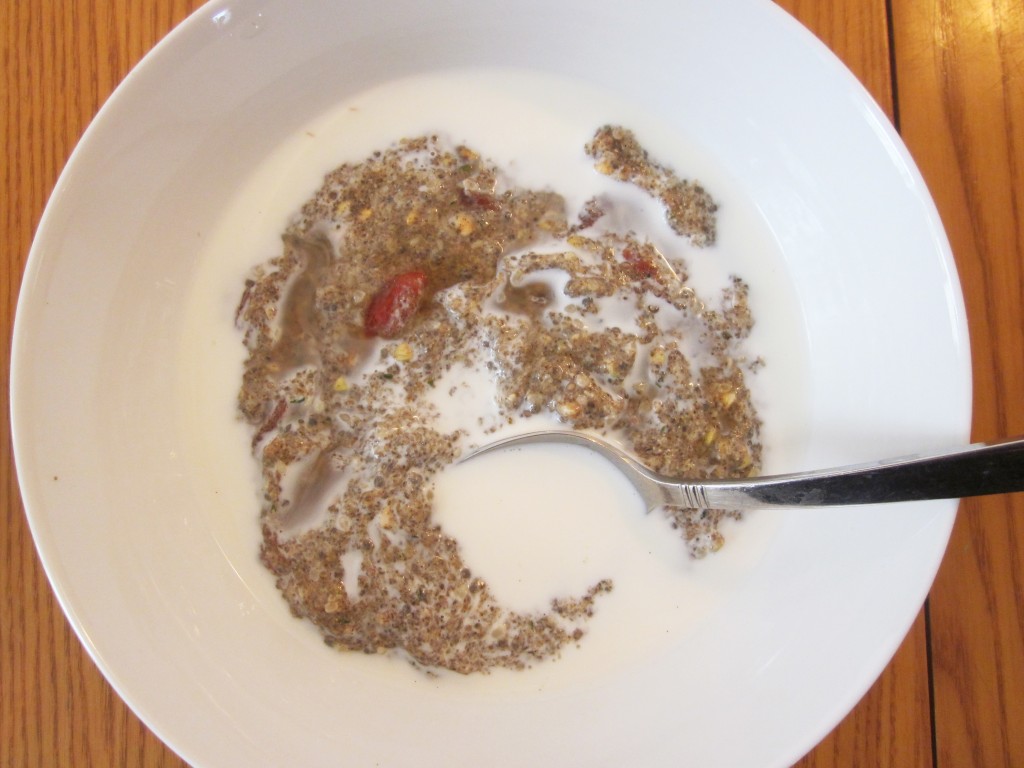 Healthy Breakfast Cereal - Warm Chia Hemp Super Cereal  in bowl with almond milk and a spoon