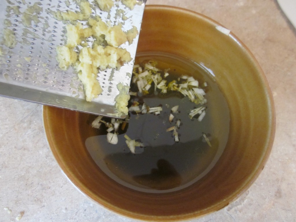 Sesame Ginger Dressing - ingredients in bowl, adding ginger