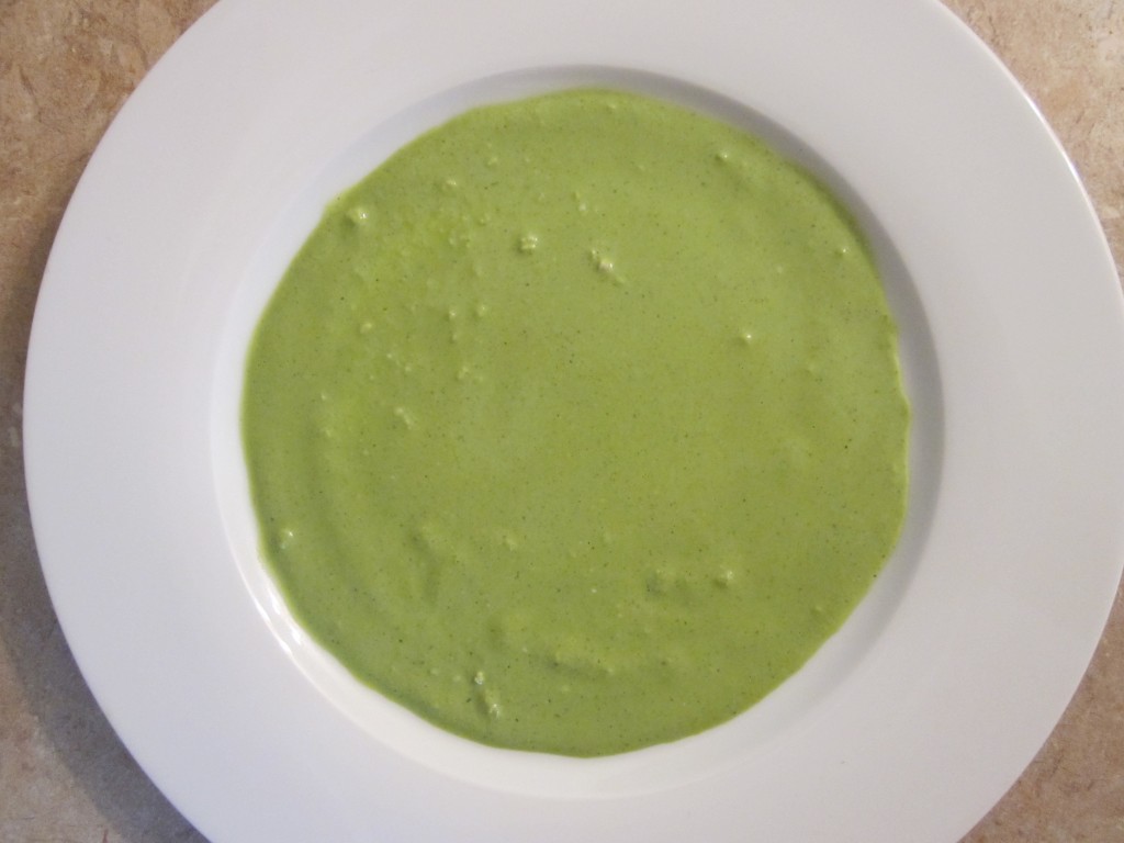 Beet Ravioli with Cashew Cheese, Wilted Spinach and Rocket Sauce plating with rocket sauce