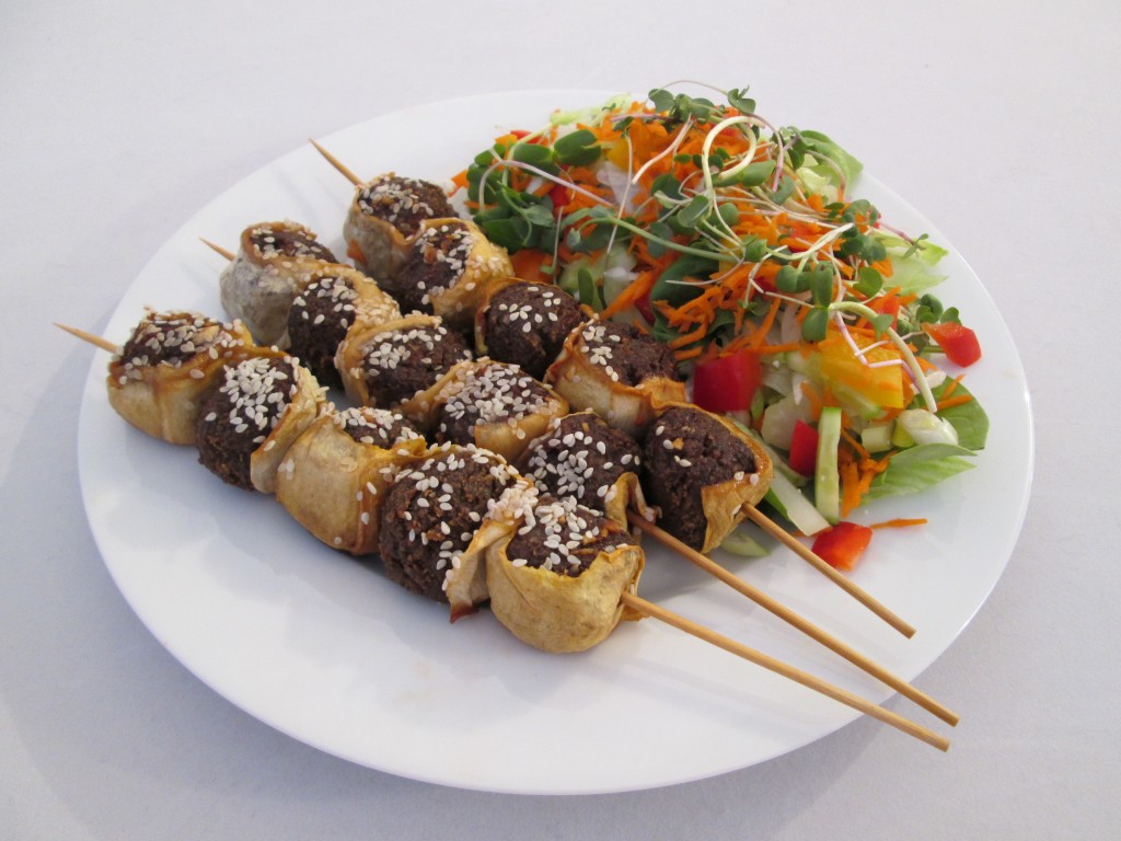 Zucchini and Nutmeat Skewers with Chili Garlic Sauce Recipe plated with salad