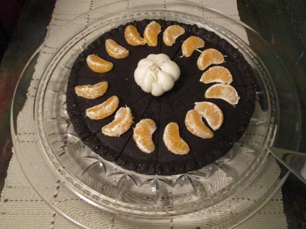 Chocolate Ganache Cake with garlic and tangerines